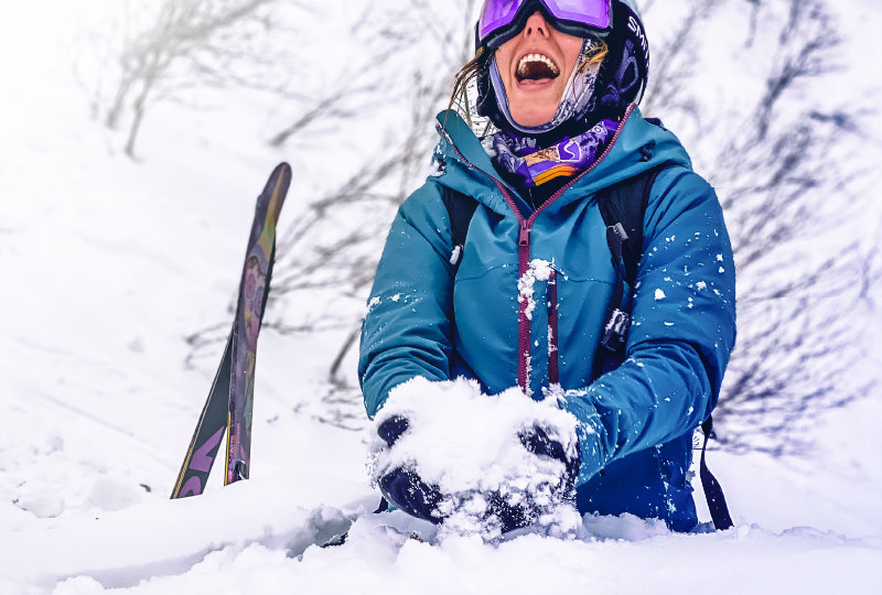 A woman having fun in snow