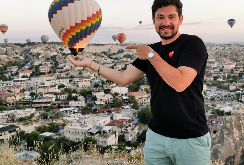 a man holding a montgolfier